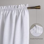 a close up of a white curtain with a gold rod